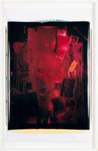 Assemblage of photographs and boxing glove painted with dripping red paint against a dark background