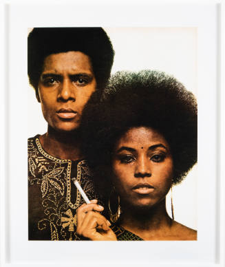 Cropped photograph of a Black man and a Black woman holding a cigarette and looking directly at us