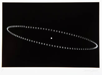 Stop motion photograph capturing an elliptical path of a silver ball centered around a white circle