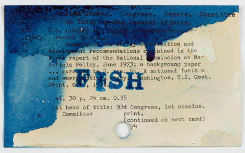 Dark blue watercolor blots and the word “FISH” stamped on a beige library catalog card