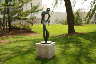 Figure-shaped sculpture with two vertical elliptic shapes with holes in the center