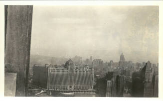 Black-and-white photo view of Merchandise Mart as seen from the ledge of a skyscraper