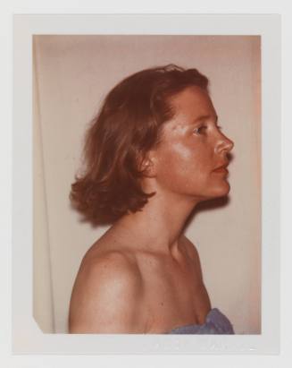 Polaroid portrait of light-skinned woman in profile with dark blonde hair in strapless shirt