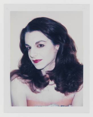 Polaroid portrait of woman with long, dark hair, white cakey makeup, and red lipstick