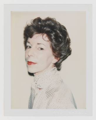 Polaroid portrait of light-skinned woman with upswept hair, white cakey makeup, lipstick, and blouse