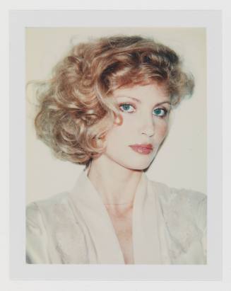 Polaroid portrait of light-skinned woman with blonde, bobbed curly, hair and white blouse or robe