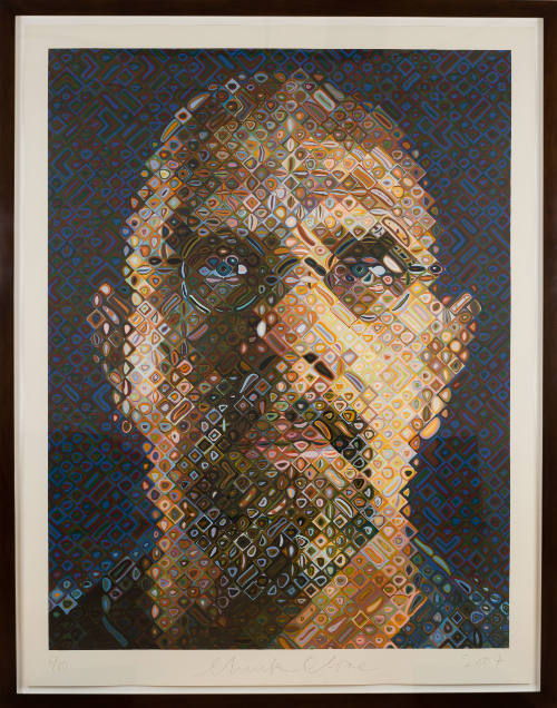 Color portrait composed from gridded squares of a man with medium-light skin tone wearing glasses