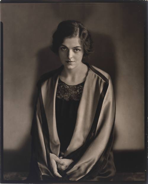 Three-quarter length portrait of Helen Gahagan wearing a flowing garment and short wavy hair