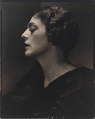 Bust-length profile portrait of Ethel Barrymore facing left, looking down, and wearing dark garment
