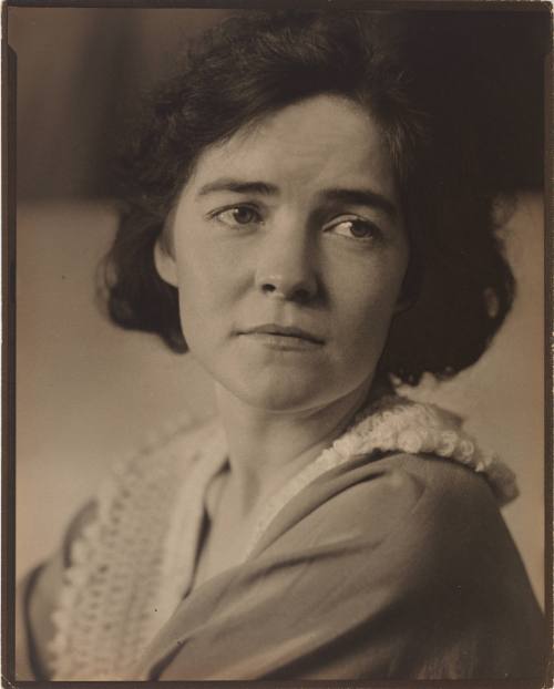 Portrait of Dana Steichen, a light-skinned woman, wearing lace collar and looking over her shoulder