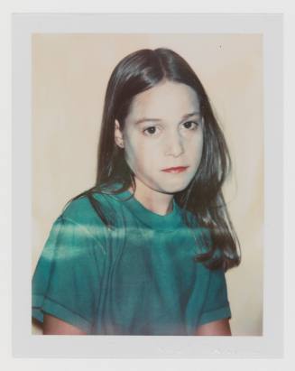 Polaroid portrait of girl with light skin tone and long, straight hair wearing green t-shirt