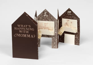 Accordion-folded paper in shape of a house with text and photos and accordion-folded text inserts
