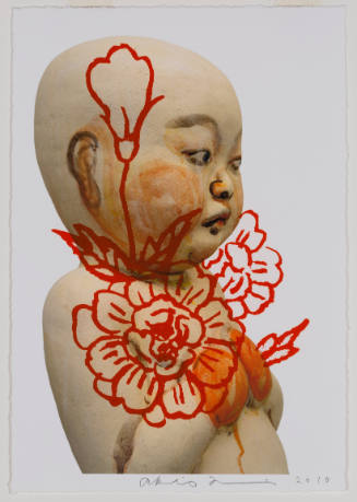 Photograph of a sculpture of a baby with a flower drawn over it in thick red paint