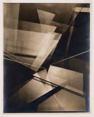 Sepia-tone photograph of glass panels facing different directions and producing layered reflections