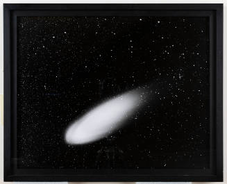 Black and white photograph of a fast-moving comet