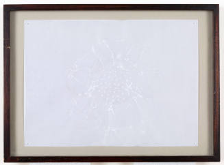 White wax paper with coencentric dots at center and crinkle marks, pinned to beige cloth in frame
