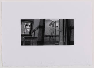 Dark interior with image of a woman in gown in window and image of woman in riding pants on wall