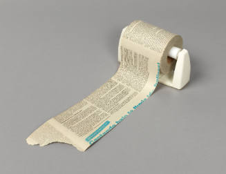Toilet paper roll made of Cuban newspapers in a toilet paper holder made for wall mounting